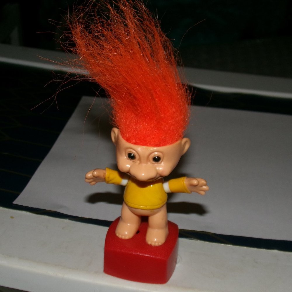 old vintage troll hard plastic he moves when you push on the bottom.